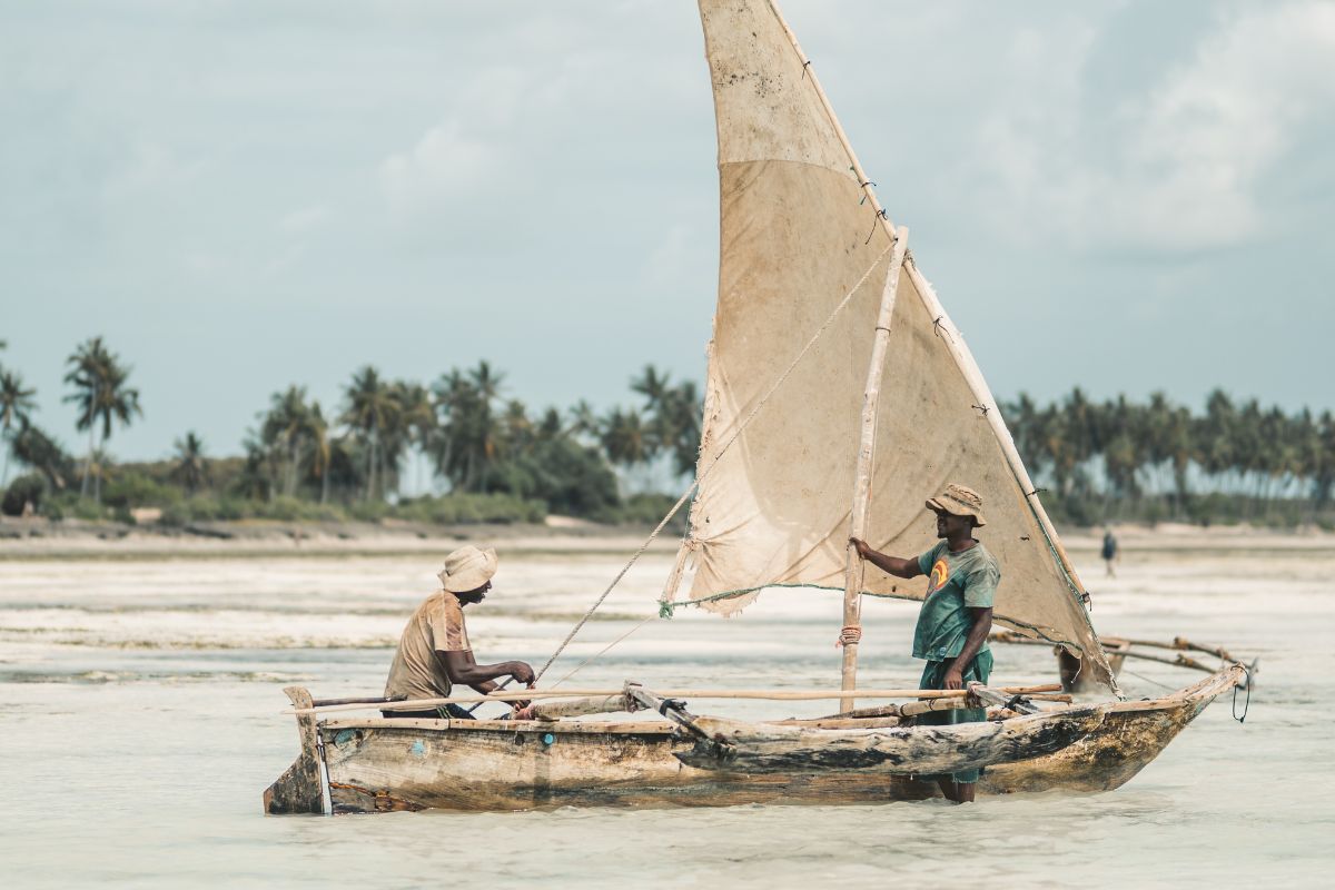 Zanzibar fishermen on dhow boat in the Indian Ocean